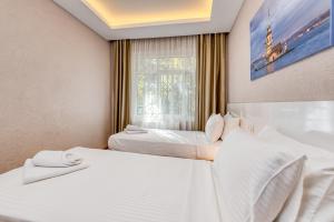 Postel nebo postele na pokoji v ubytování Port Apart Hotel
