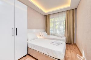 Postel nebo postele na pokoji v ubytování Port Apart Hotel