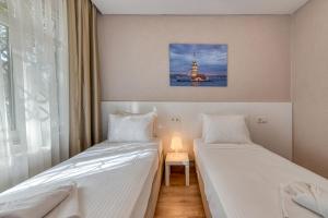 Postel nebo postele na pokoji v ubytování Port Apart Hotel