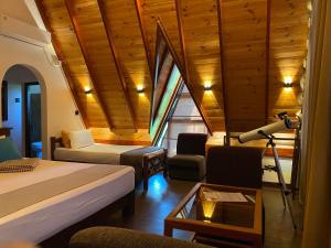 a room with two beds and a room with a lamp at Ella nine arch spice garden in Ella