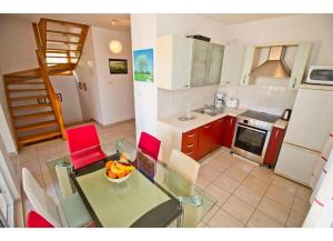 Kuchyň nebo kuchyňský kout v ubytování Apartment Mana