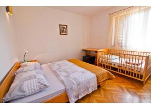 Postel nebo postele na pokoji v ubytování Apartment Mana