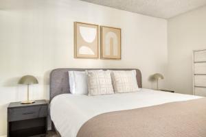 a bedroom with a bed with white sheets and pillows at N Hollywood 1BR w Gym Pool nr shops LAX-515 in Los Angeles +13 photos
