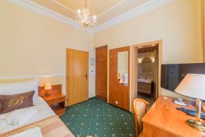 Ένα ή περισσότερα κρεβάτια σε δωμάτιο στο Hotel Bajkal