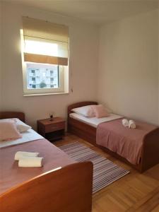 Posteľ alebo postele v izbe v ubytovaní Apartment Mari