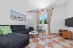 TV a/nebo společenská místnost v ubytování Apartment Uga2
