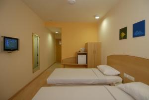 Rúm í herbergi á Ginger Bhubaneshwar