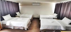 Ein Bett oder Betten in einem Zimmer der Unterkunft X GO INN Chiang Mai University - CMU โกอินน์ มหาวิทยาลัยเชียงใหม่