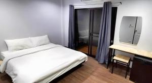 Ein Bett oder Betten in einem Zimmer der Unterkunft X GO INN Chiang Mai University - CMU โกอินน์ มหาวิทยาลัยเชียงใหม่