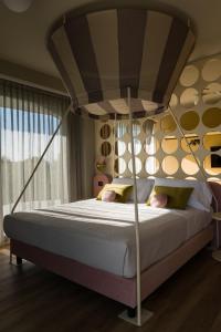 Postel nebo postele na pokoji v ubytování Hotel La Gradisca + 37 fotografií