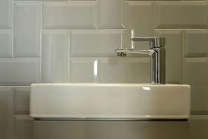 a bathroom sink with a faucet on top of it at The Willow - Studio 17 in Bristol