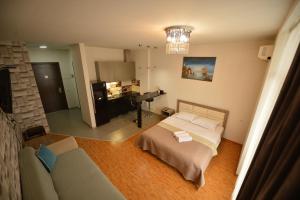 En eller flere senge i et værelse på GRAND APARTAMENTS ORBi SEA TOWERS