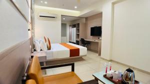 TV a/nebo společenská místnost v ubytování Hotel Ashray Inn Express