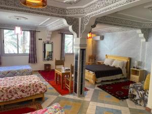 Postel nebo postele na pokoji v ubytování RIAD Camping ATLAS