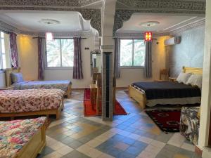 Postel nebo postele na pokoji v ubytování RIAD Camping ATLAS