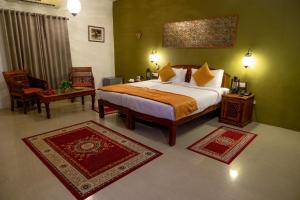 Ένα ή περισσότερα κρεβάτια σε δωμάτιο στο Indian Adventures Tiger Moon resort +40 φωτογραφίες