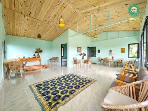 a large living room with a table and chairs at Midori Heritage Coffee Farm in Da Lat