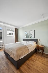 Postel nebo postele na pokoji v ubytování Limehome Basel Münzgasse