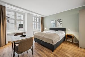 Postel nebo postele na pokoji v ubytování Limehome Basel Münzgasse