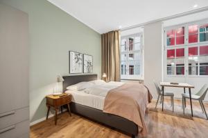 Postel nebo postele na pokoji v ubytování Limehome Basel Münzgasse