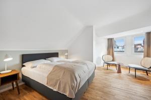 Postel nebo postele na pokoji v ubytování Limehome Basel Münzgasse