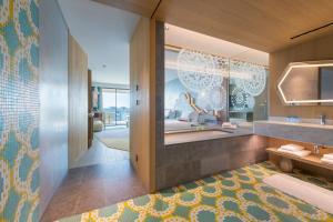 a bathroom with a sink and a mirror at W Algarve in Albufeira