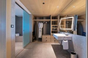 a bathroom with a sink and a mirror at W Algarve in Albufeira