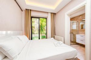 Postel nebo postele na pokoji v ubytování Port Apart Hotel