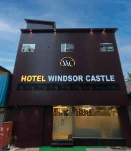 a hotel windsor castle sign on the side of a building at Hotel Windsor Castle in Mumbai