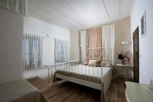 Postel nebo postele na pokoji v ubytování Evdokia Boutique Hotel