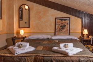 Postel nebo postele na pokoji v ubytování Hotel Gran Trun