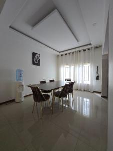 a dining room with a table and chairs at Dk Casa in Lusaka