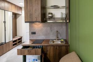 a kitchen with a sink and a counter top at Garda - Breakfast included in the price Restaurant Free Parking Mountain view Kitchen in the apartment separate entrance in Bukovel +48 photos