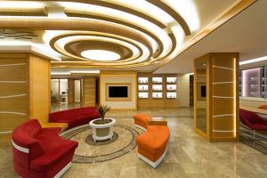 a lobby with red furniture and a coffered ceiling at Prestige Hotel Old City in Istanbul