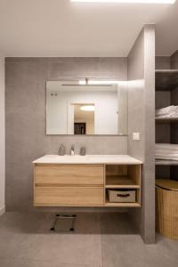 a bathroom with a sink and a mirror at EDEN RENTALS La Laguna Heritage Residence in La Laguna