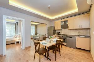 Kuchyň nebo kuchyňský kout v ubytování Port Apart Hotel