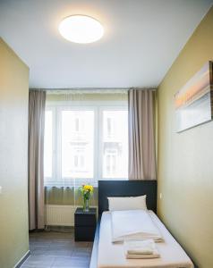 Postel nebo postele na pokoji v ubytování Hotel City Star