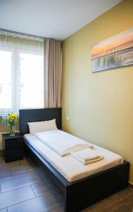Postel nebo postele na pokoji v ubytování Hotel City Star