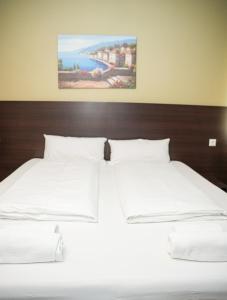 Postel nebo postele na pokoji v ubytování Hotel City Star