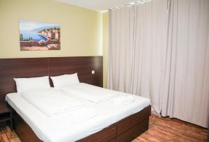 Postel nebo postele na pokoji v ubytování Hotel City Star