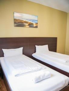 Postel nebo postele na pokoji v ubytování Hotel City Star