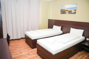 Postel nebo postele na pokoji v ubytování Hotel City Star