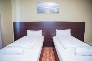 Postel nebo postele na pokoji v ubytování Hotel City Star