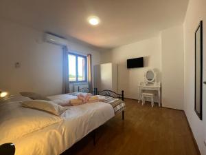 Postel nebo postele na pokoji v ubytování Apartment Šterna in Svetvincenat
