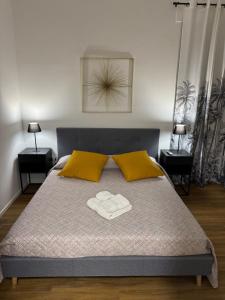 a bedroom with a bed with two towels on it at Dreaming Ortona in Ortona