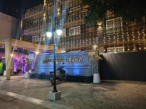 a street light in front of a building at night at Rosewood Grand in Faridabad