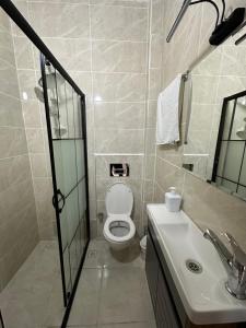 a bathroom with a toilet and a sink at The Square 30 in Istanbul +44 photos