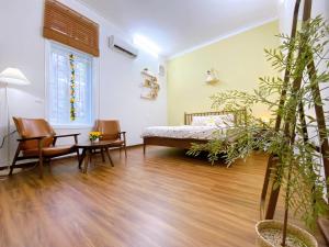 Ein Bett oder Betten in einem Zimmer der Unterkunft Mô Tê Homestay 2 gần Chợ Đông Ba, Cung Đình Hoàng Thành Huế