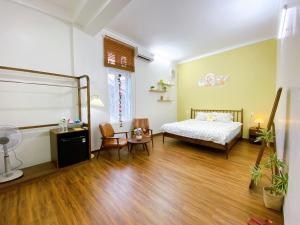 Ein Bett oder Betten in einem Zimmer der Unterkunft Mô Tê Homestay 2 gần Chợ Đông Ba, Cung Đình Hoàng Thành Huế