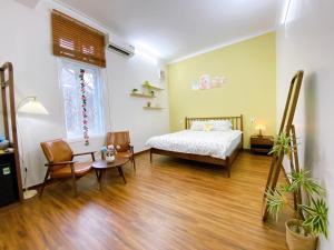 Ein Bett oder Betten in einem Zimmer der Unterkunft Mô Tê Homestay 2 gần Chợ Đông Ba, Cung Đình Hoàng Thành Huế